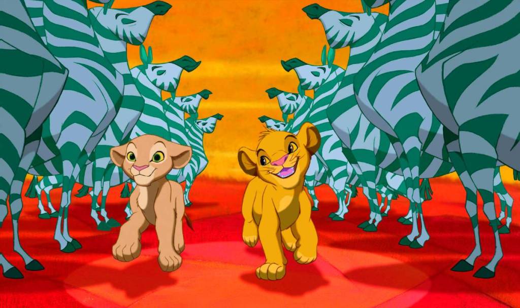 Dois filhotes de leão, Simba e Nala, a dançar com zebras em «O Rei Leão»