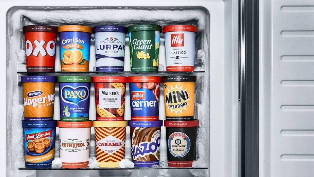 a freezer with door open showing stacked ice cream tubs with unusual flavours