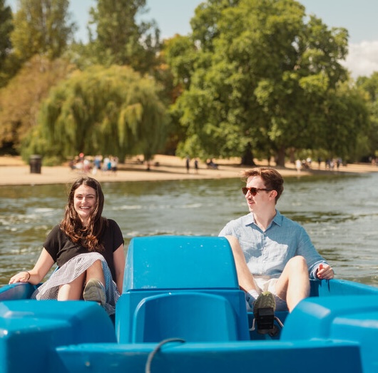a couple on a pedalo boat at hyde park