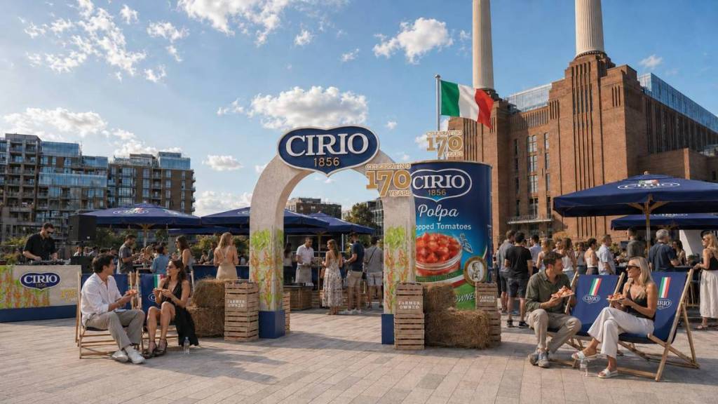 cirio pop-up outside battersea power station, through an archway there is seating and a giant cirio tomato can