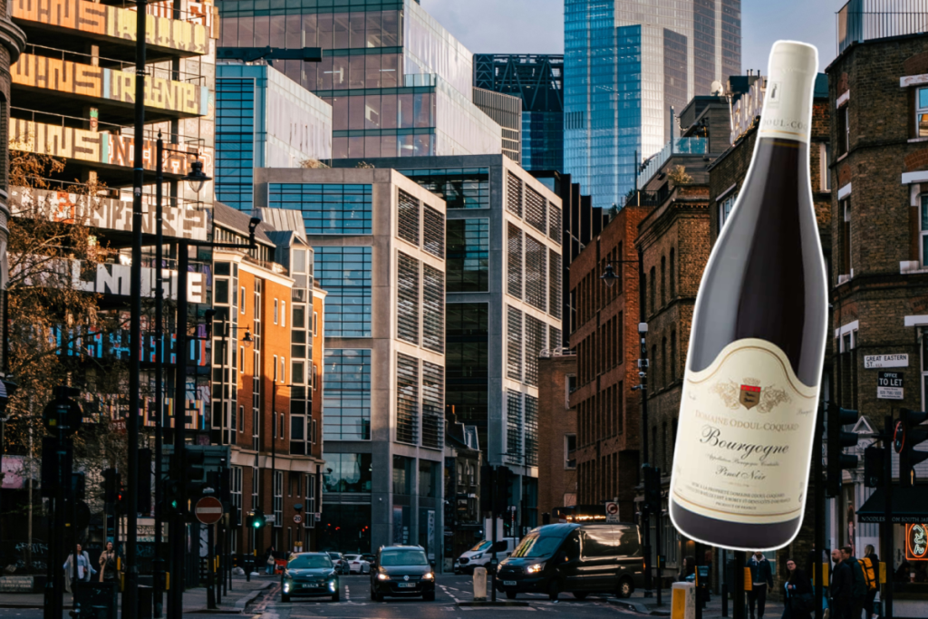 a collage of a wine bottle over a background image of london neighbourhood shoreditch with tall office buildings and skyscrapers