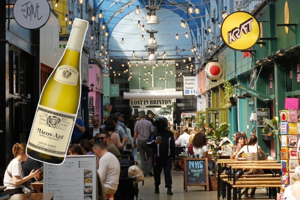 a collage of a wine bottle over a background image of london neighbourhood brixton, showing a vibrant and colourful sheltered market
