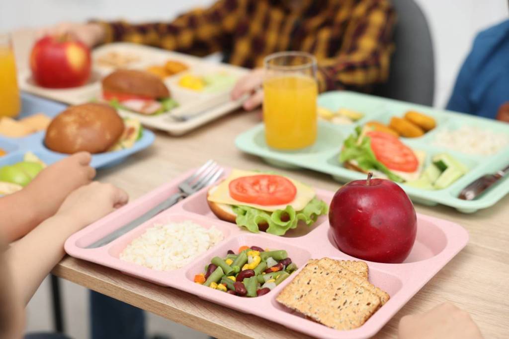 A table with school dinner trays