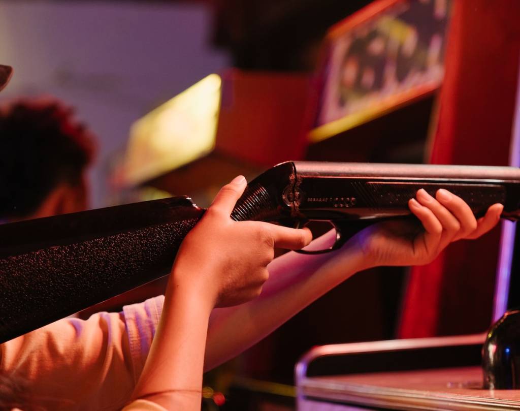 A close of up someone aiming in a clay shooting range