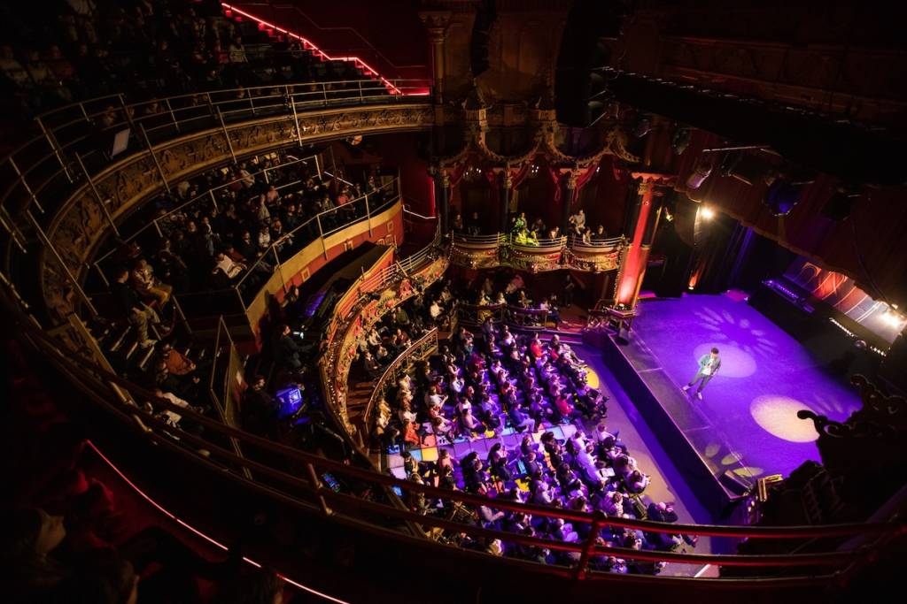 An aerial view of a large theatre and a spotlit stage
