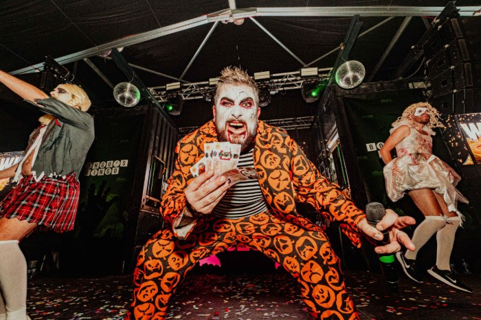a man dressed up in a halloween costume with paint on his face