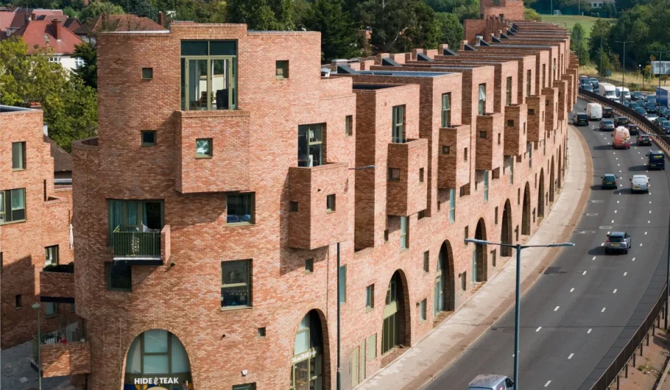 A tiny sliver of land beside one of London’s busiest roads has been transformed into a hidden neighbourhood of 97 homes