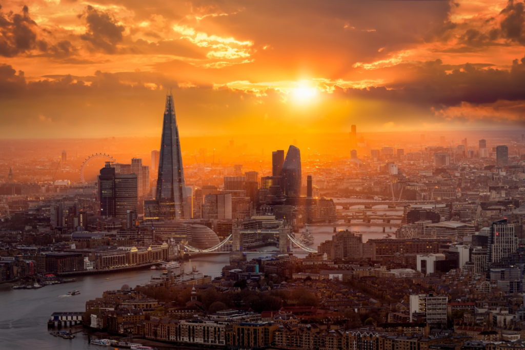 The sun setting over the Shard and Tower Bridge and the River Thames