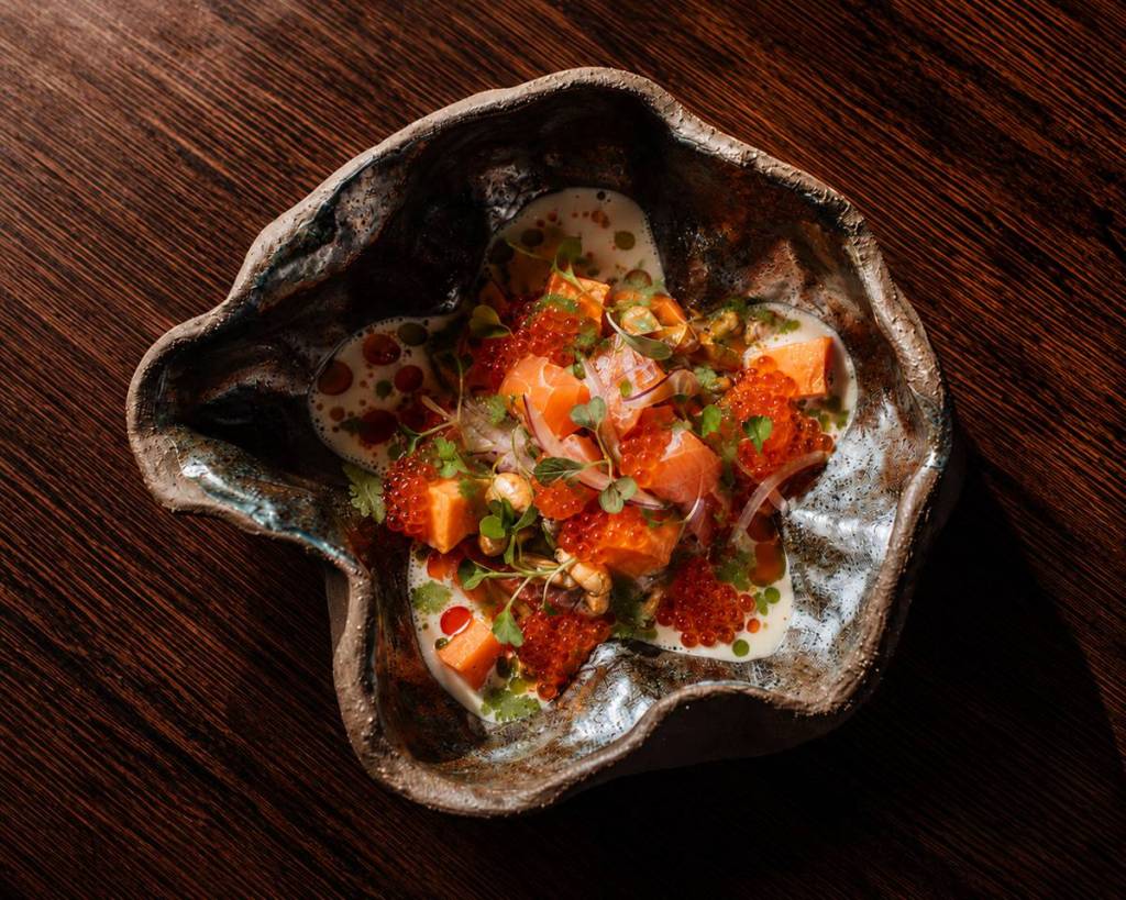 a shell-shaped bowl with colourful ceviche inside at Bamboo matt Canary Wharf