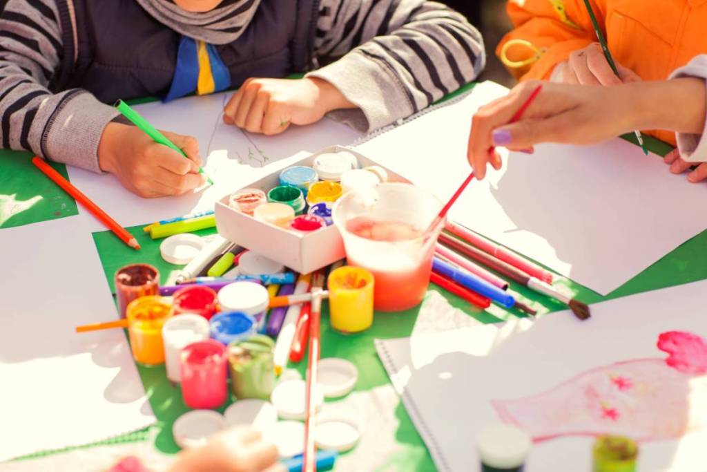 A child painting at a table