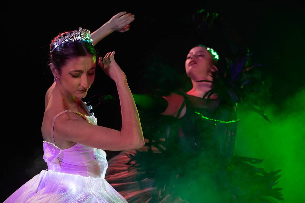 Sleeping Beauty being cursed by the witch on stage at a ballet show