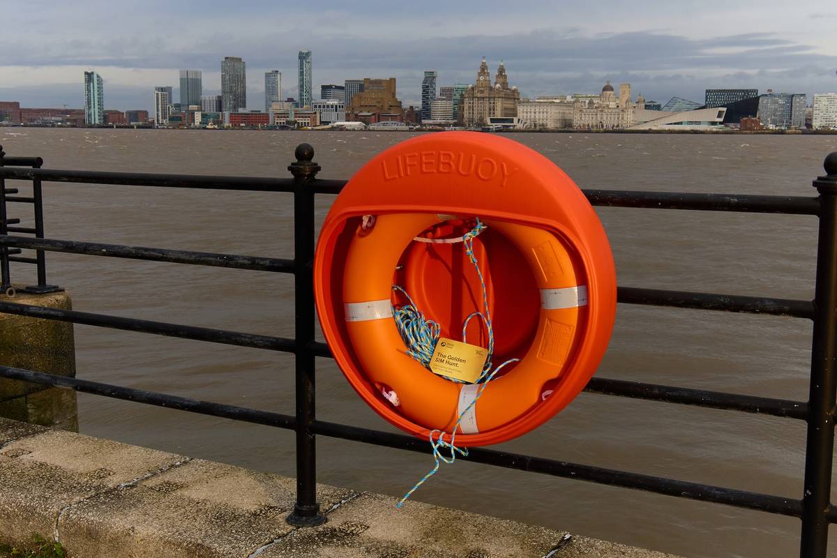 a golden sim card hidden in a life ring in liverpool