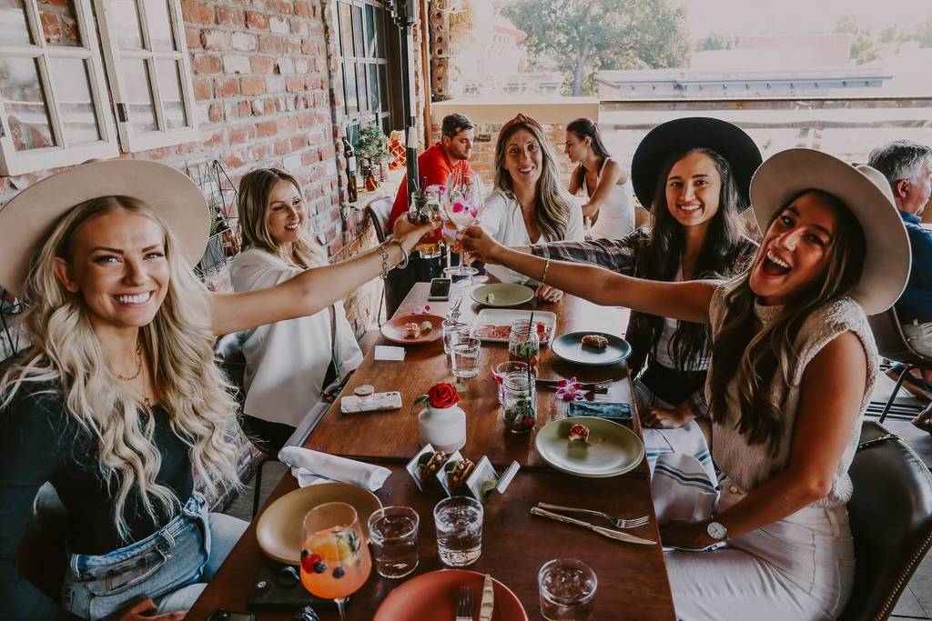 People toasting at a restaurant table