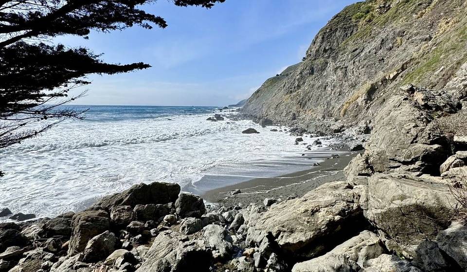 This Hidden Black Sand Beach Near SoCal Has A 300-Foot Waterfall—But You’ll Have To Hike To Find It