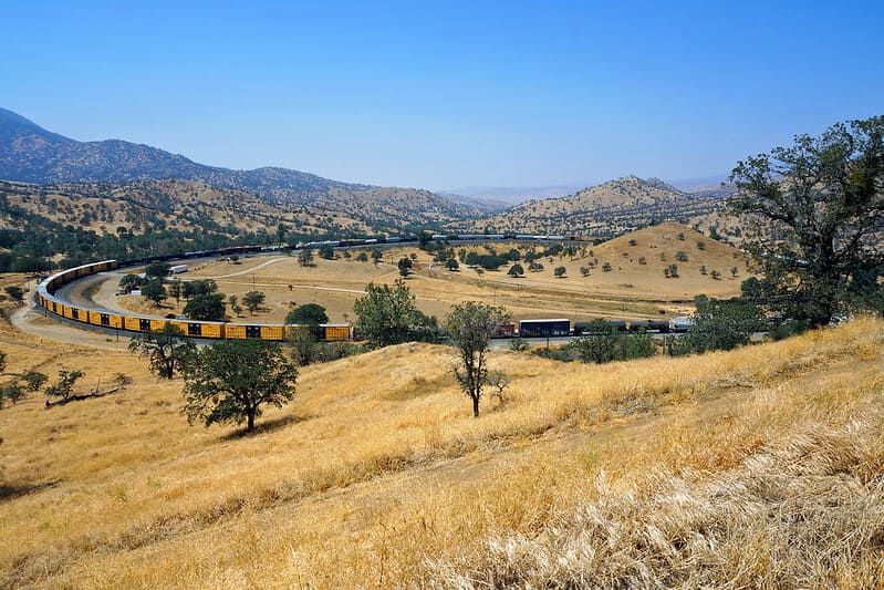 A train passes through the Tehachapi Loop in california
