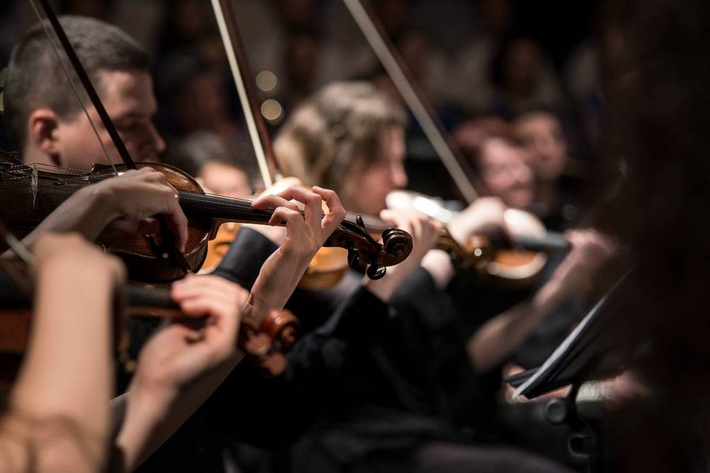 An orchestra performing at a classical music concert