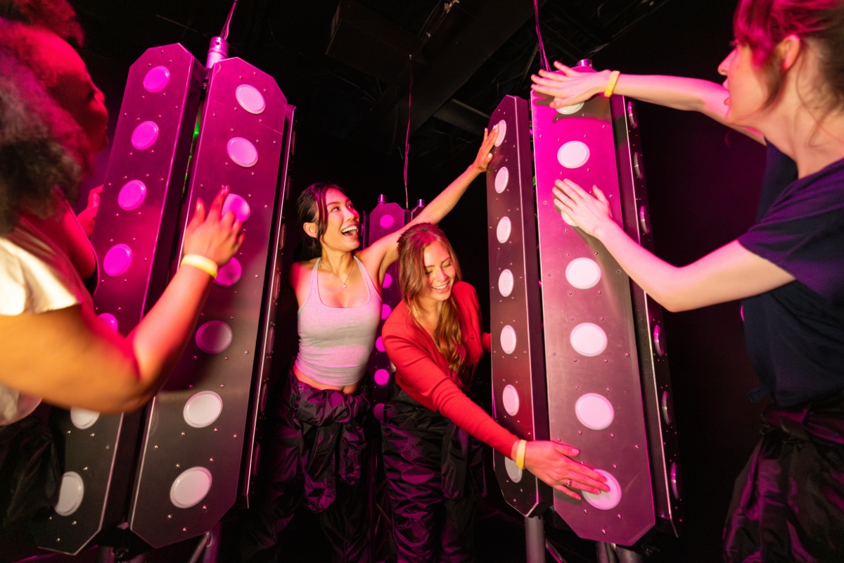 Guests make their way through the challenge rooms at Glow or Go