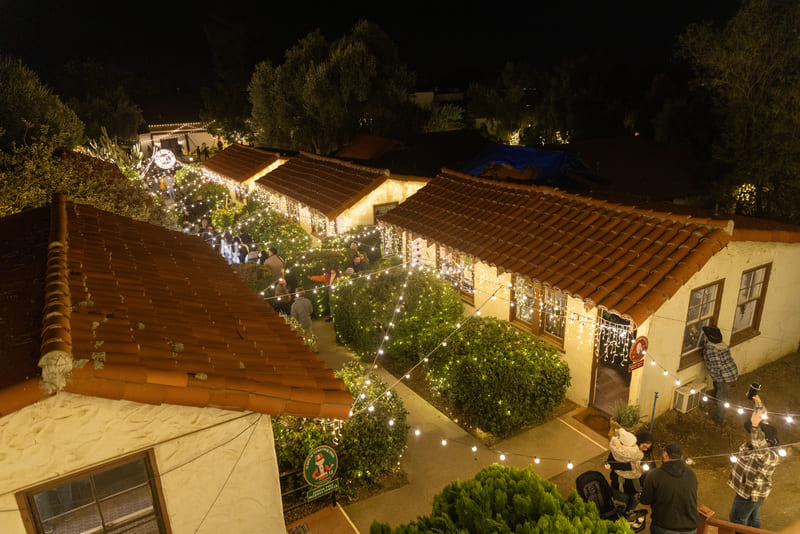 Buildings with Christmas lights at 123 Farm
