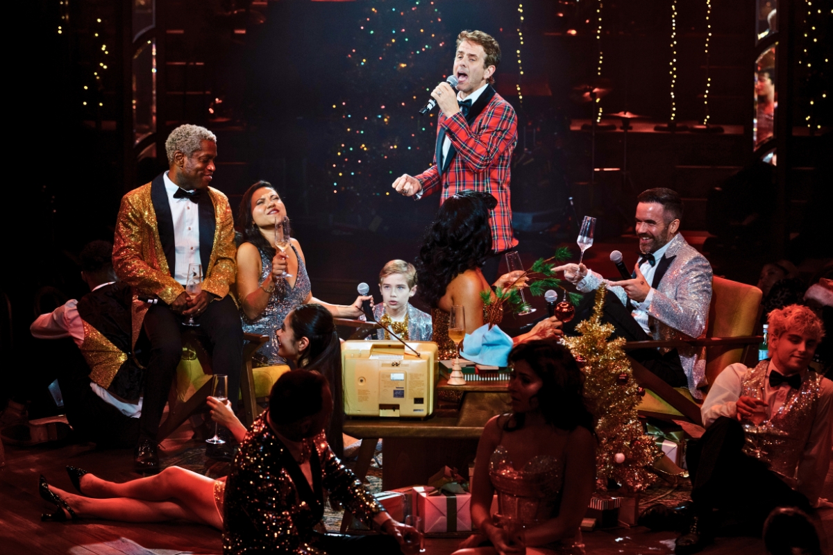 Performers sing onstage at TINSELCOLOR