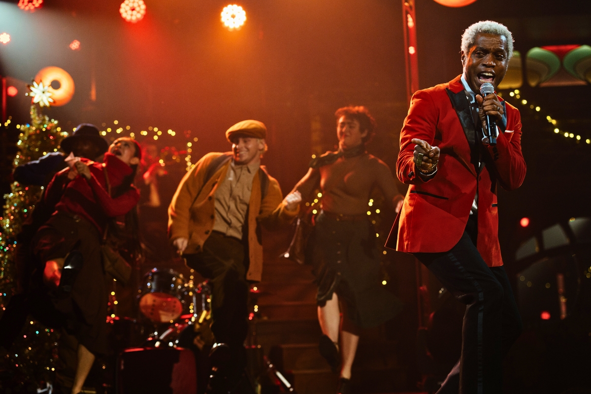 Performers sing onstage at TINSELCOLOR