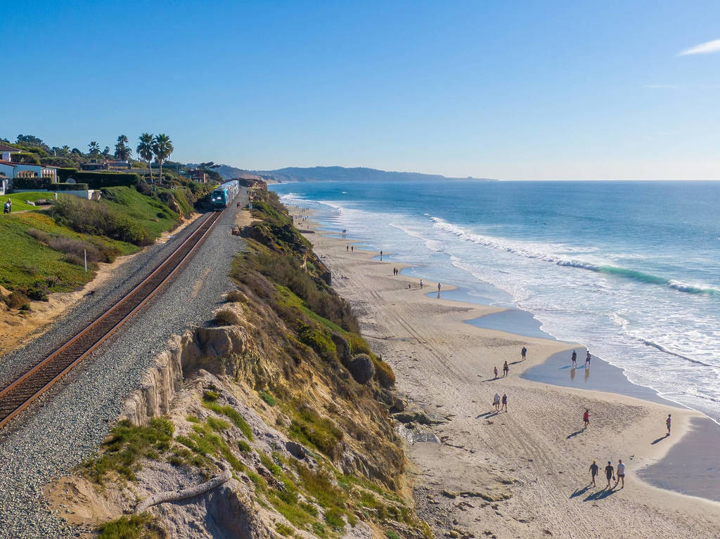 Amtrak Pacific Surfliner above a beach in California