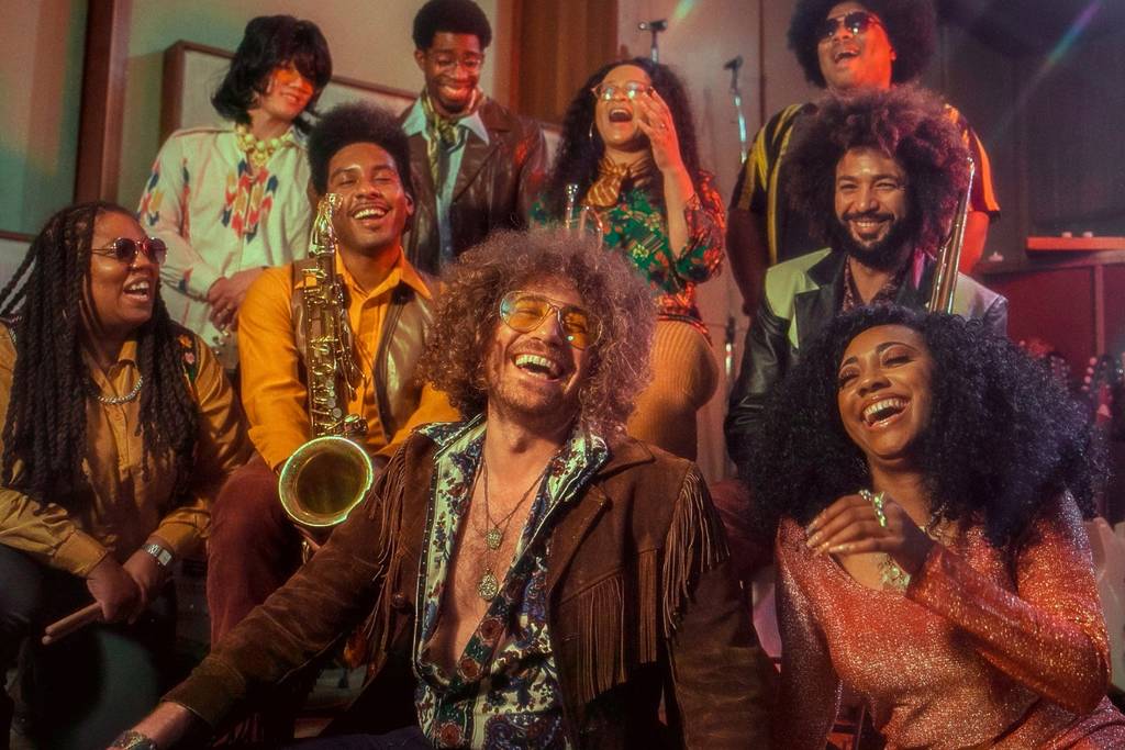 Guests and performers play music and dance at Brassroots