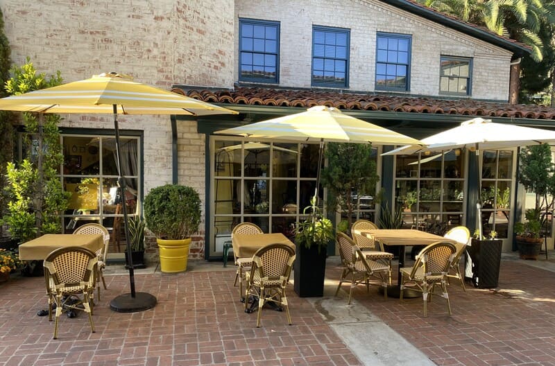 Yellow umbrellas and chairs at Malaga Cove plaza