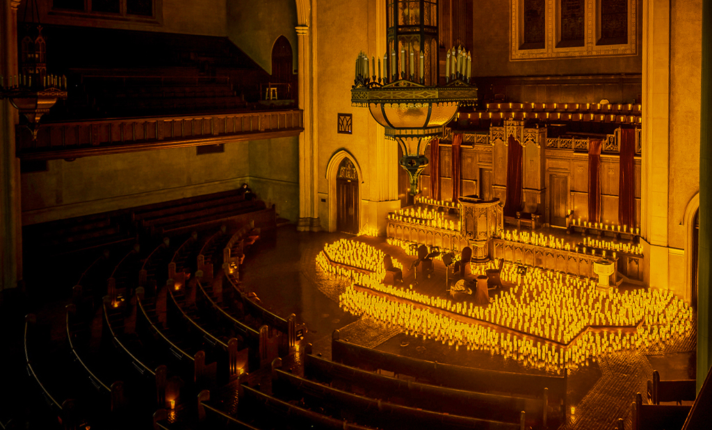 Inside of Immanuel Presbyterian Church in Los Angeles lit up by candlelight