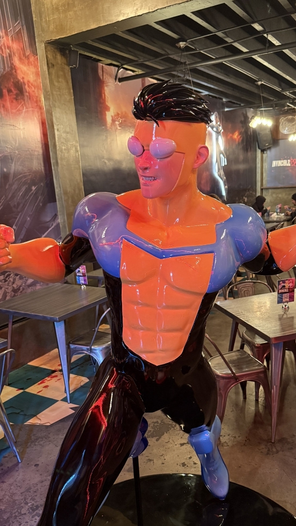 An immersive 'Invincible' pop-up just landed in Los Angeles — complete with a life-sized Mark Grayson statue, arcade game nights, and themed boba