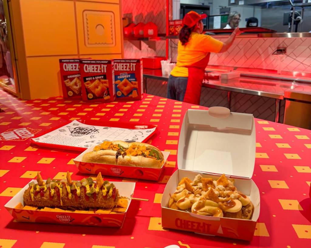 a selection of the cheez-it menu items at the cheez-it court experience in takeout boxes