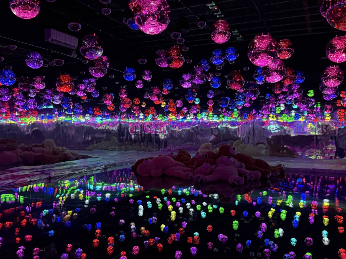 Unlike normal museums, this new multi-sensory exhibition in L.A.’s Arts District lets you touch everything—featuring 7 glowing worlds, giant plush bears, and a massive illuminated ball pit