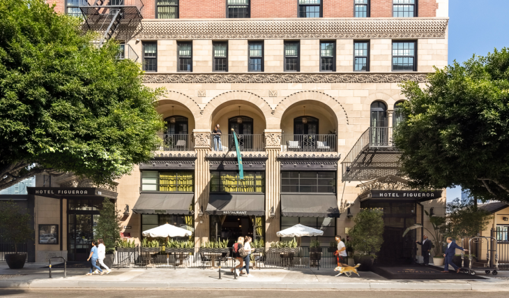In 1926, LA’s Hotel Figueroa opened as a groundbreaking safe haven for female travelers; exactly 100 years later, the historic landmark is serving spooky seasonal cocktails by its famous coffin-shaped pool