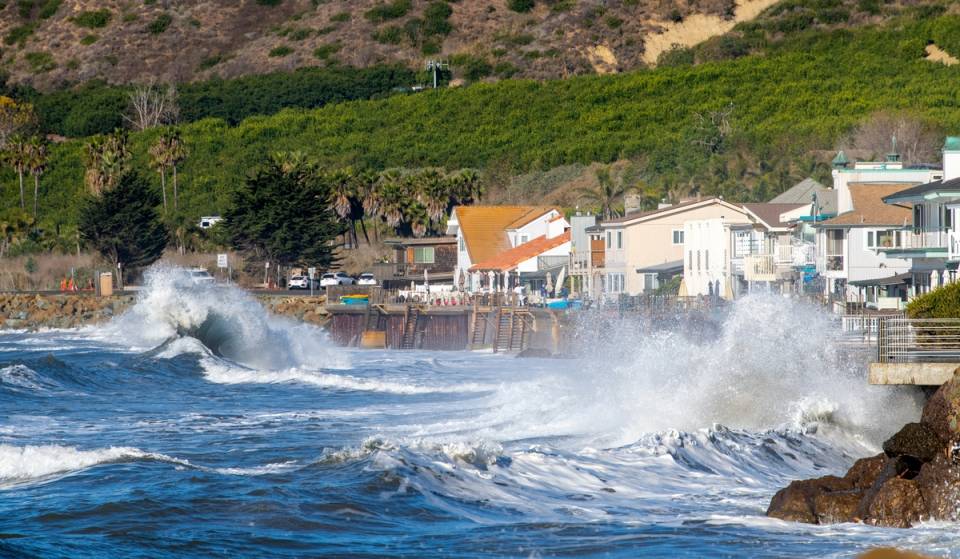 Rare 20-year lunar alignment and warm El Niño swells collide off Southern California, sending historic 8.5-foot tides crashing toward beach communities