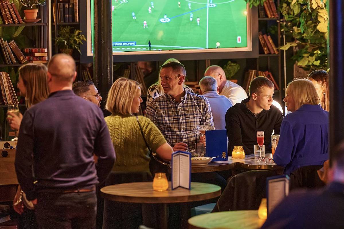 black cat club in manchester showing the football