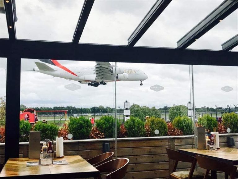 This Manchester Pub Garden Offers Views of The Airport Runways