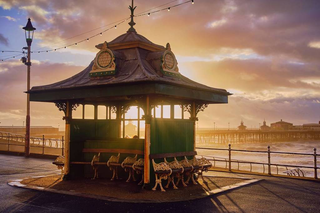 pavillion on pier at blackpool beach at sunset