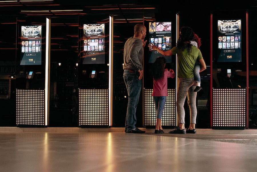 A picture of a family getting their Vue cinema tickets