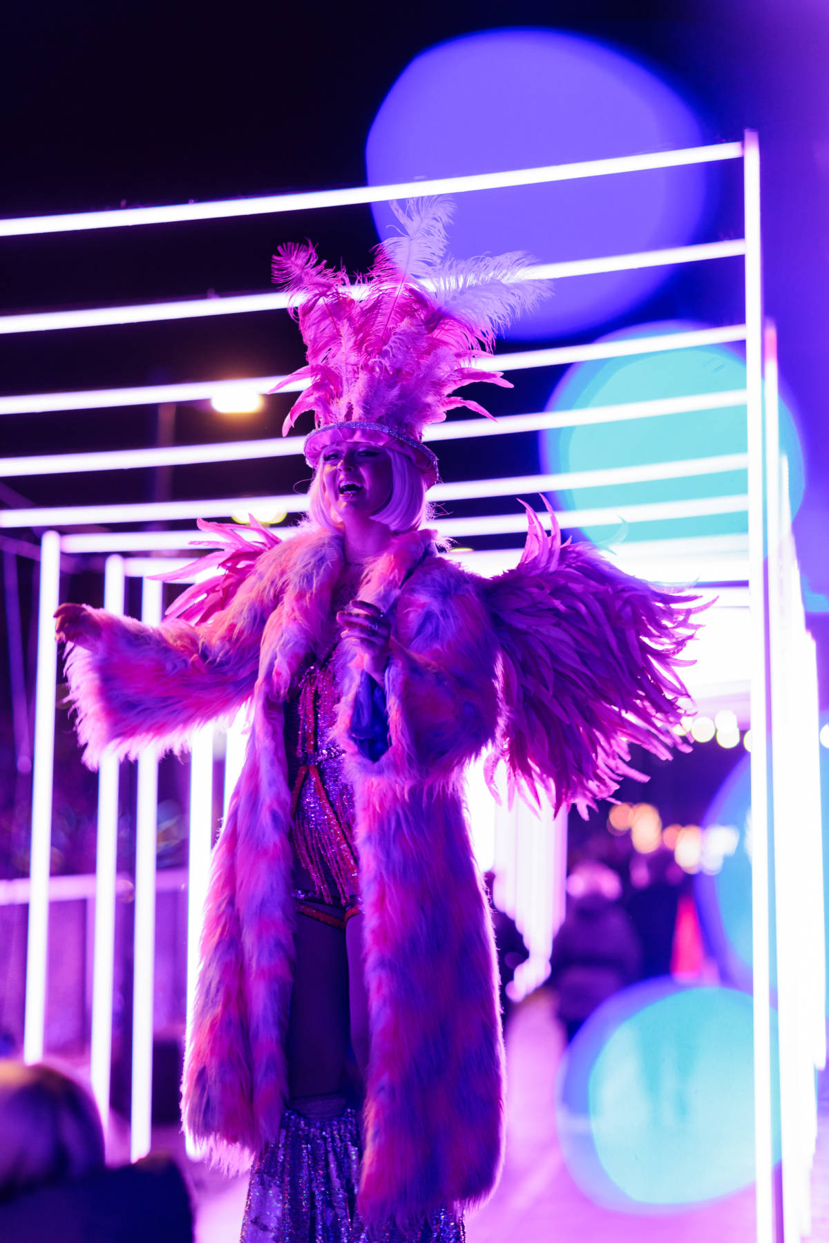 performer on stilts at twilight trail