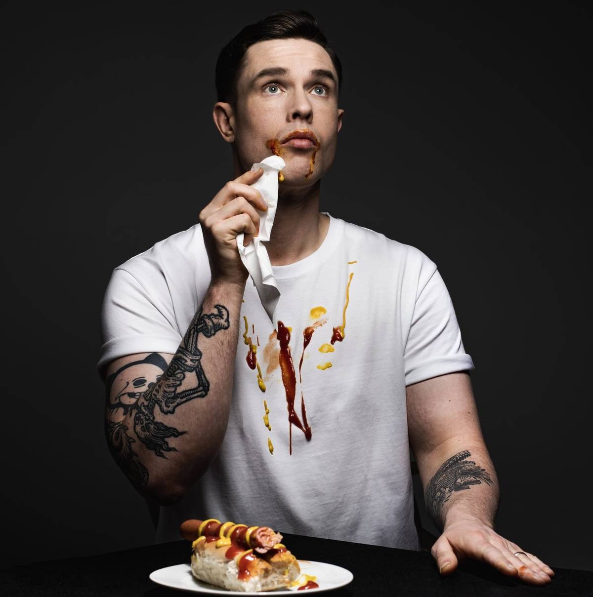 ed gamble mopping face with condiments down white t-shirt