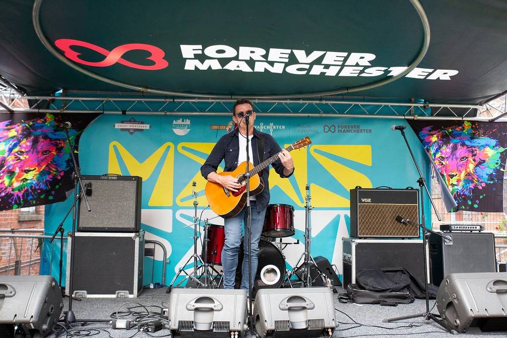 singer on stage at deansgate mews festival