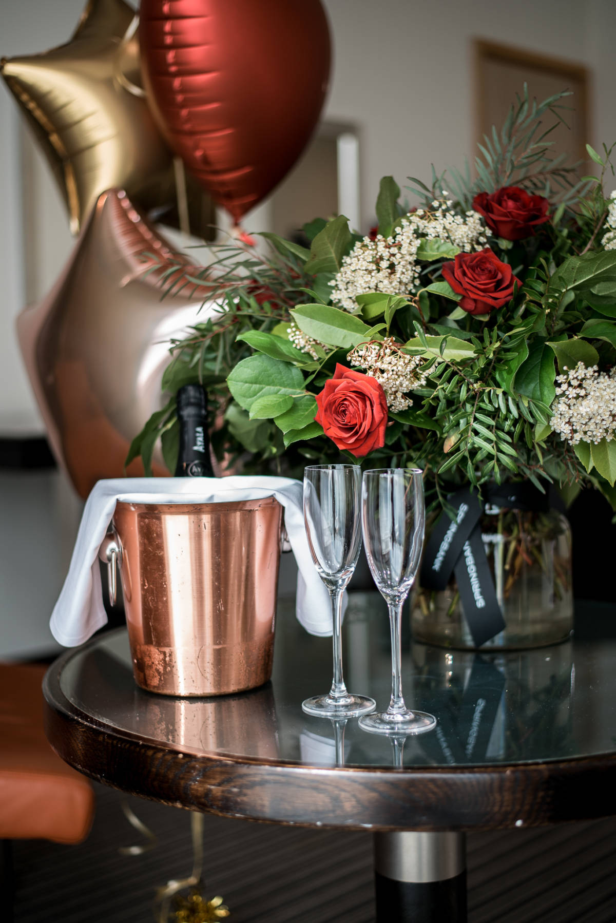 champagne and flowers on table at the lowry hotel graduation package manchester