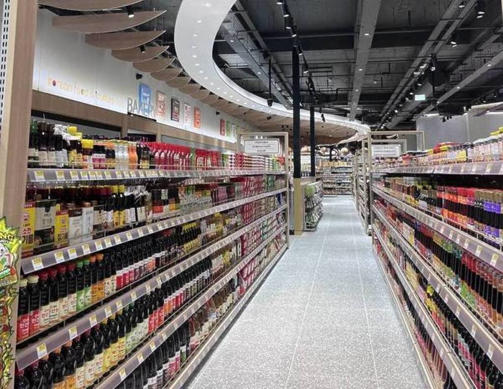 inside oseyo manchester arndale with rows of shelves with cooking sauces on