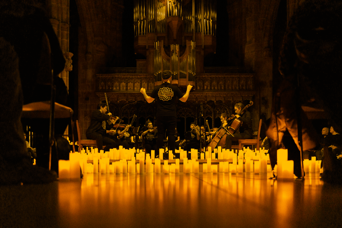 A string quartet performing by candlelight in Manchester