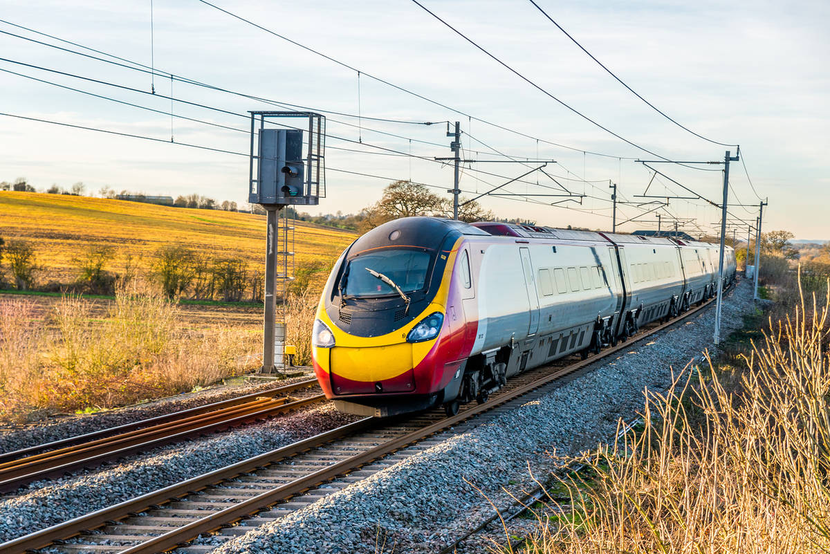 train-on-track-in-countryside-staffordshire-to-manchester-airport-railway-planned