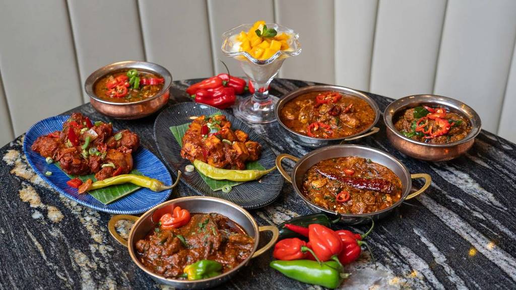 selection of chilli dishes and curries and mago dessert at zouk in manchester for national chilli day