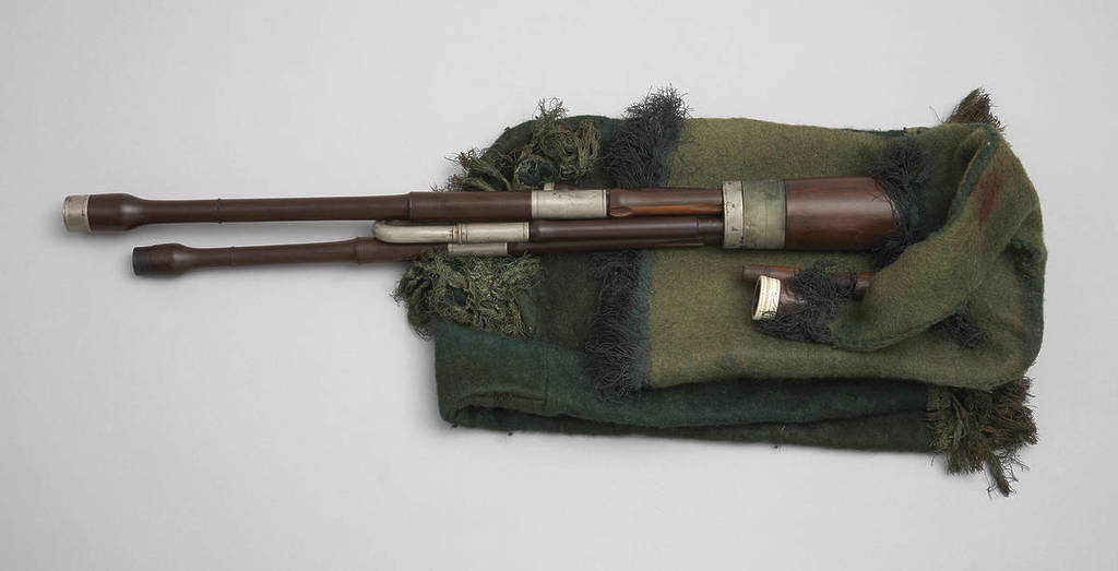 historical green bagpipe folded-down-laid-flat