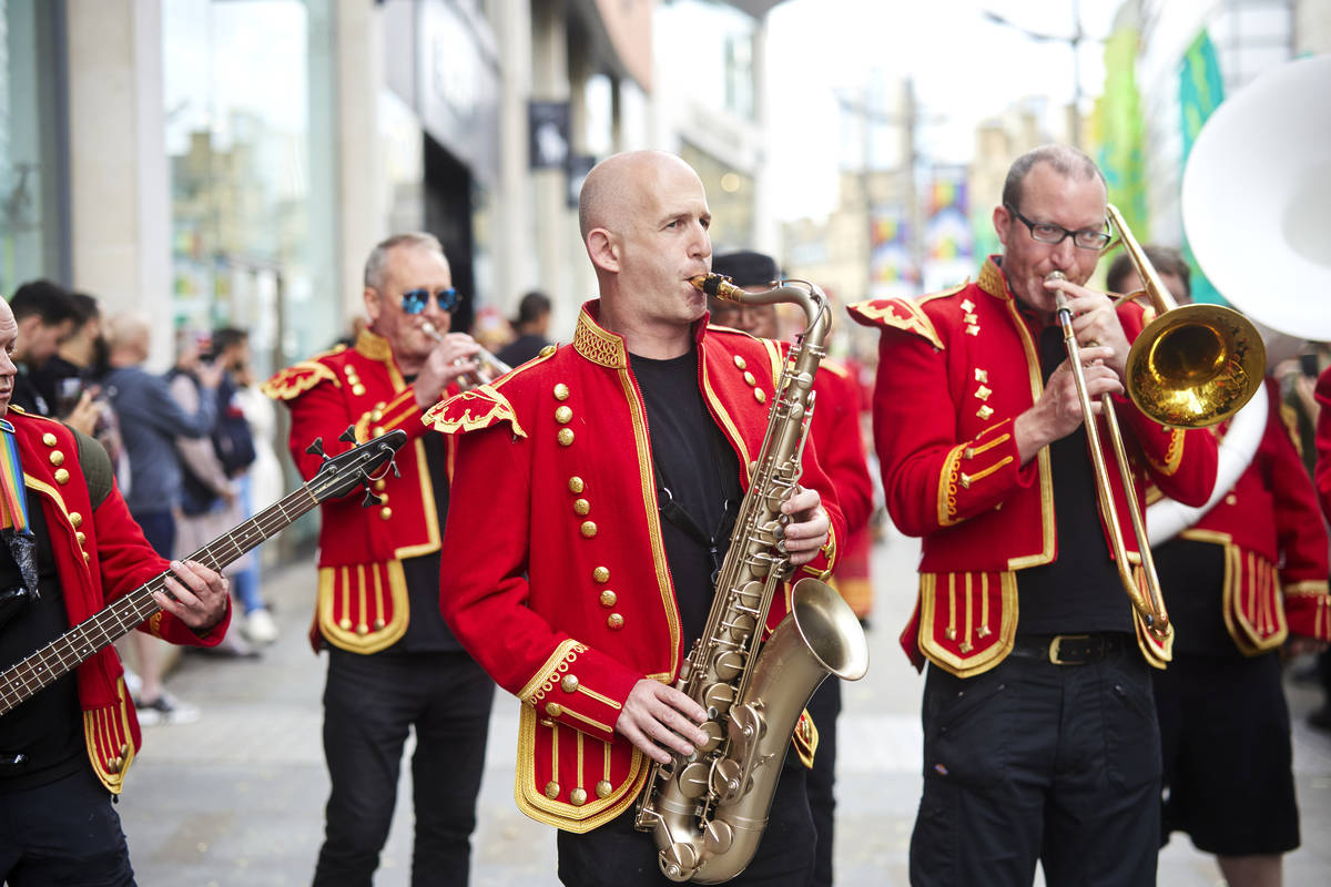 musicians playing in street as part of manchester day celebrations