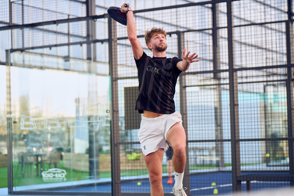 man playing padel on court at the padel club traffordcity