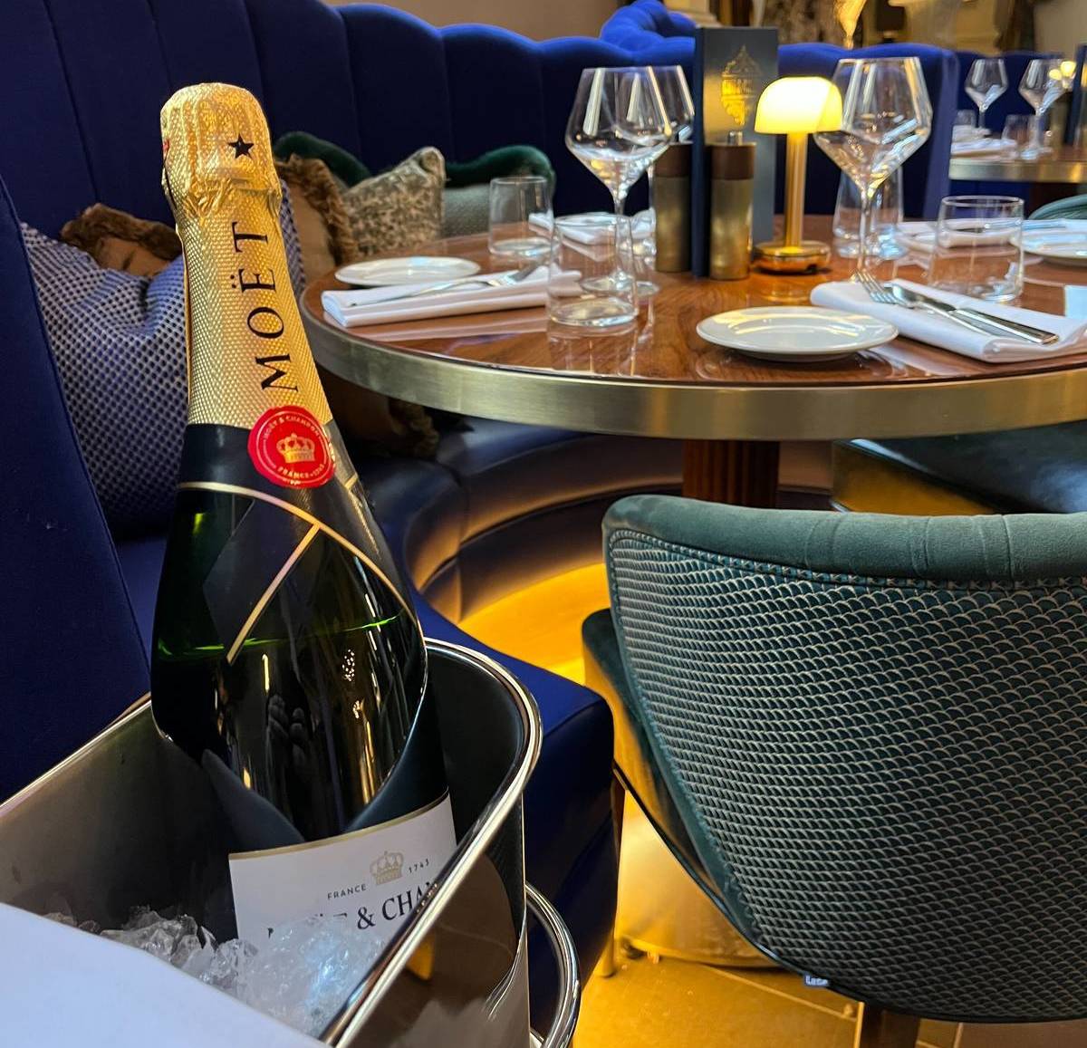 bottle of moet champagne in ice bucket in dining room at the cut and craft manchester