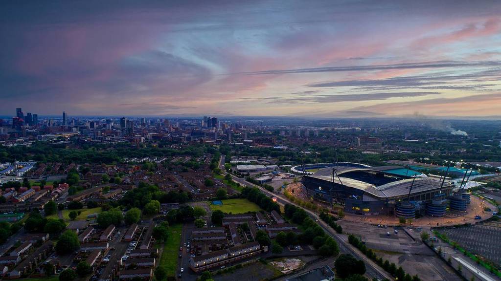 etihad stadium in manchester at sunset